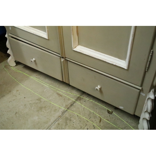 613 - Antique over-painted wardrobe, in the French style, having raised central pediment, above two doors ... 