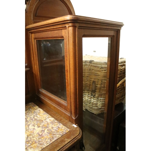 617 - Early 20th century oak chiffonier, having large mirror back with bevelled arched plate enclosed with... 