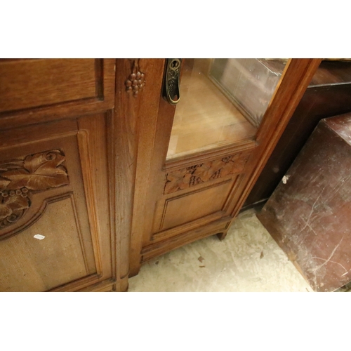 617 - Early 20th century oak chiffonier, having large mirror back with bevelled arched plate enclosed with... 