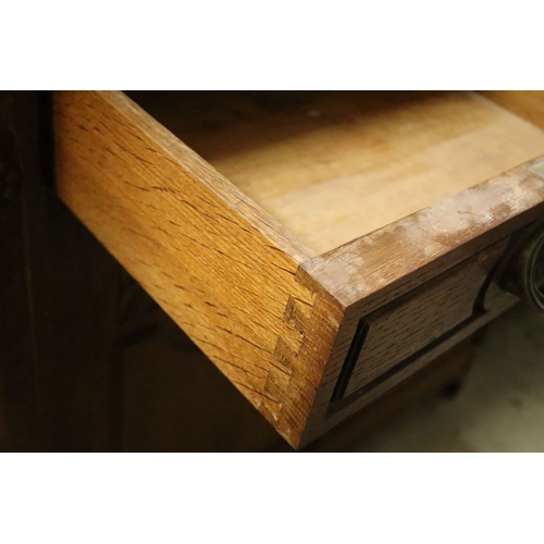 617 - Early 20th century oak chiffonier, having large mirror back with bevelled arched plate enclosed with... 