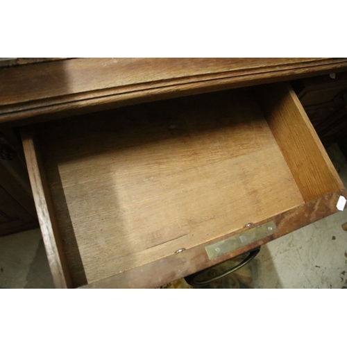 617 - Early 20th century oak chiffonier, having large mirror back with bevelled arched plate enclosed with... 