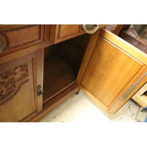 617 - Early 20th century oak chiffonier, having large mirror back with bevelled arched plate enclosed with... 