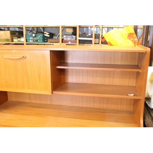 639 - Mid 20th century teak veneered sideboard, having a high back with cupboard upon three drawers, W 129... 