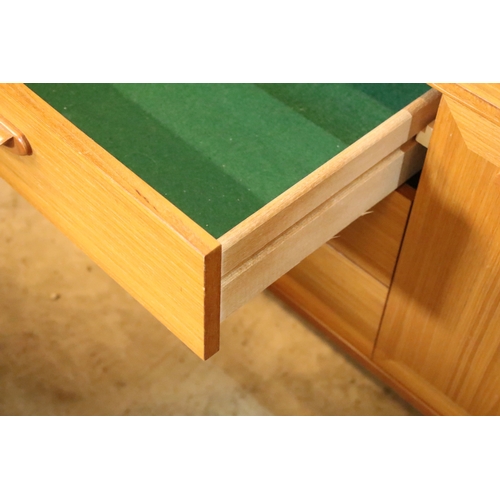 639 - Mid 20th century teak veneered sideboard, having a high back with cupboard upon three drawers, W 129... 