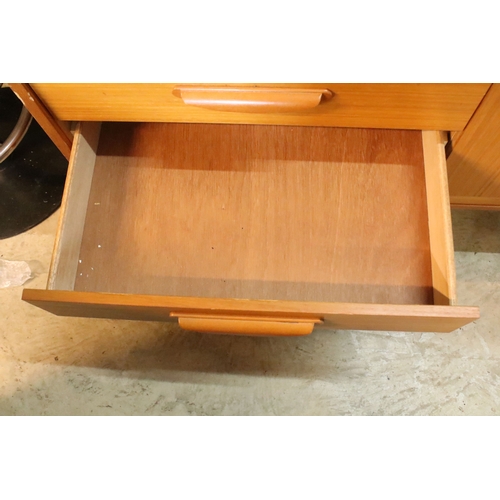 639 - Mid 20th century teak veneered sideboard, having a high back with cupboard upon three drawers, W 129... 