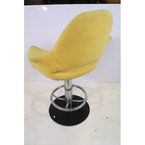 642 - Pair of 20th century egg stools, having yellow buttoned upholstery, raised on chromed stem with foot... 
