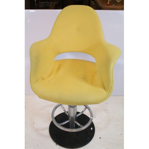 642 - Pair of 20th century egg stools, having yellow buttoned upholstery, raised on chromed stem with foot... 