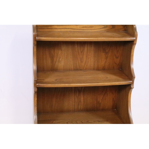 643 - Ercol 'Golden Dawn' open bookcase, having four open shelves, W 60cm x D 36cm x H 112cm