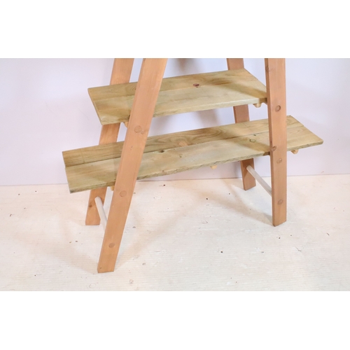 646 - Wooden part painted ladder display shelf, the hinged ladders holding three graduated pine shelves, 1... 