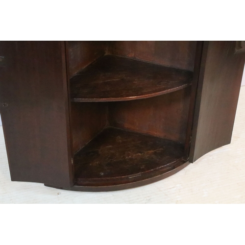 667 - 19th century mahogany bow fronted corner cupboard, having inlaid doors, W 55cm x H 92cm