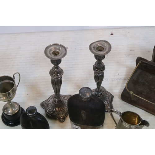 383 - Collection of silver plate, to comprise a pair of candlesticks, hip flasks, trophies, jugs, etc. tog... 