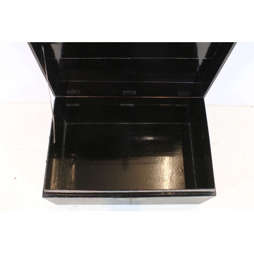 387 - Antique Chinese lacquered box, having central brass locking fixture, with brass carry handles, W 62c... 