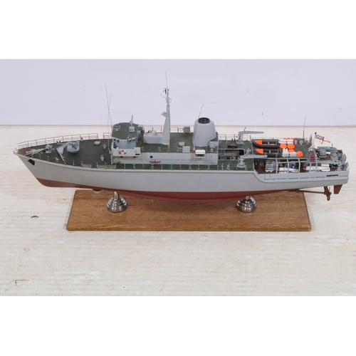388 - Model ship replica of the Royal Navy Hunt, raised on wooden plinth, L 60cm x H 29cm (approx.)