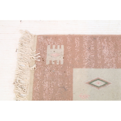 556 - Mahyar pink ground rug, having thick pink border, 98cm x 154cm (approx)