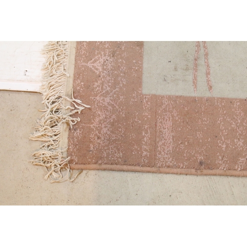 556 - Mahyar pink ground rug, having thick pink border, 98cm x 154cm (approx)