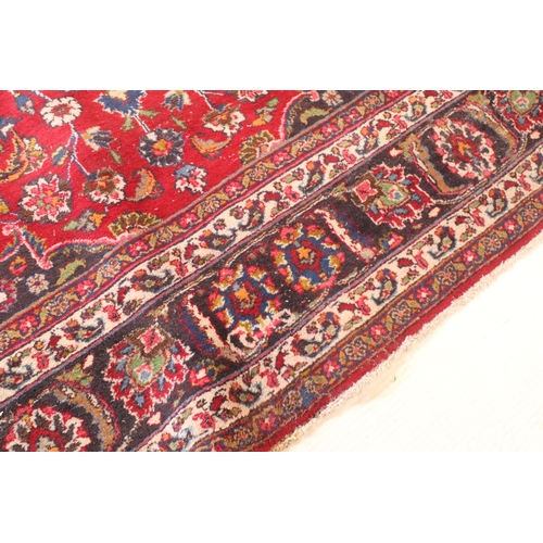 623 - Persian hand-knotted rug, of large proportions, on red and deep blue ground, 301 x 376cm