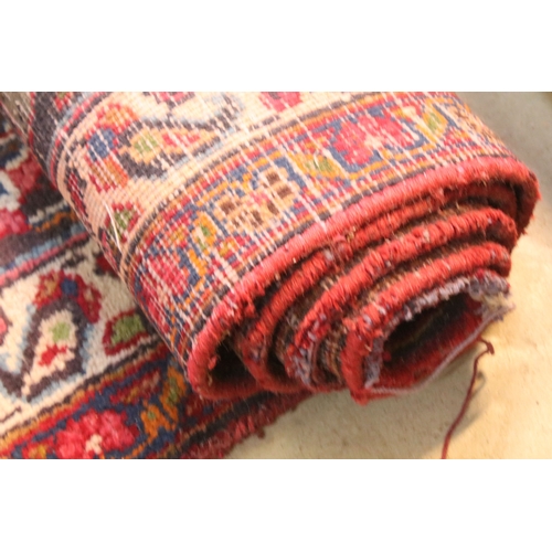 623 - Persian hand-knotted rug, of large proportions, on red and deep blue ground, 301 x 376cm