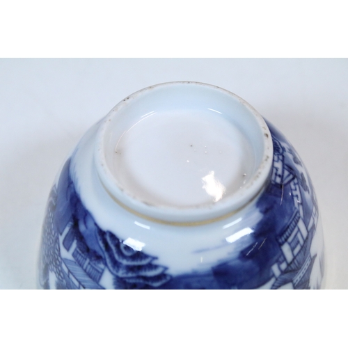 5 - Pair of Chinese blue and white tea bowls and saucers, decorated finely with pagodas and willows, gil... 