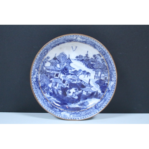 5 - Pair of Chinese blue and white tea bowls and saucers, decorated finely with pagodas and willows, gil... 