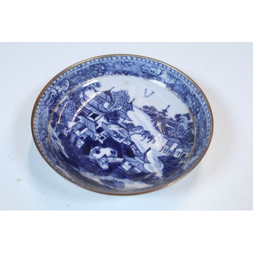 5 - Pair of Chinese blue and white tea bowls and saucers, decorated finely with pagodas and willows, gil... 