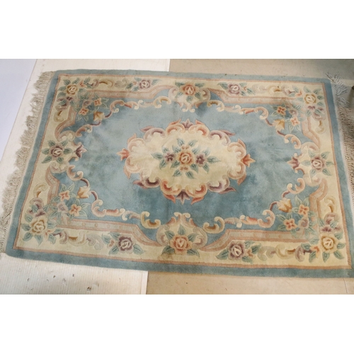 611 - 20th century Chinese-style rug, having blue ground with central medallion within floral border