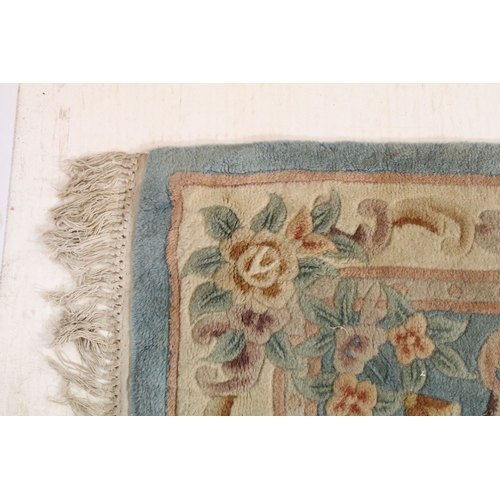 611 - 20th century Chinese-style rug, having blue ground with central medallion within floral border