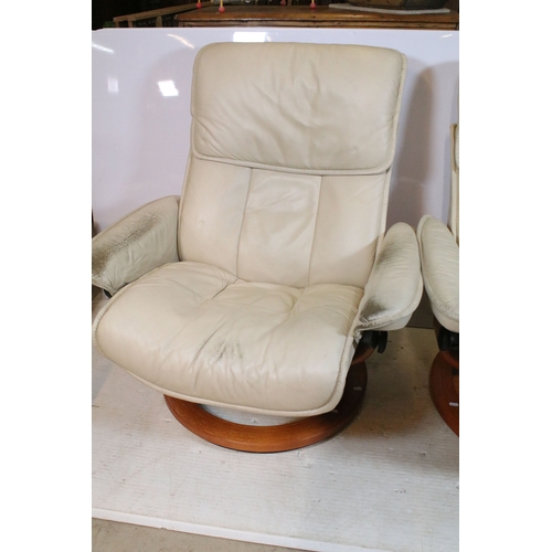 651 - Pair of Ekornes Stressless chairs, having beige upholstery, each with a corresponding footstool, W 8... 