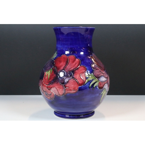 7 - Moorcroft 'Anemone' pattern vase on deep blue ground, impressed and signed to base, H 24cm