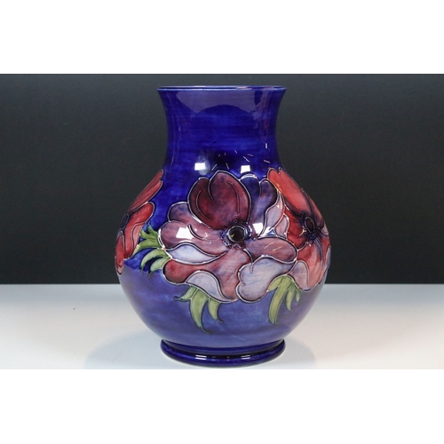 7 - Moorcroft 'Anemone' pattern vase on deep blue ground, impressed and signed to base, H 24cm