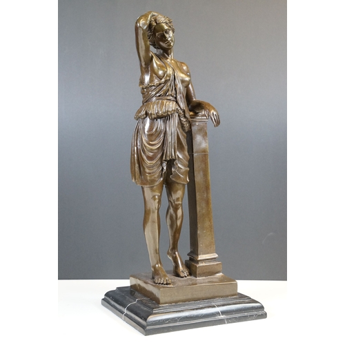 106 - Bronze classical figurine statue of semi nude female in robes resting on pillar, standing atop stepp... 