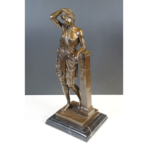 106 - Bronze classical figurine statue of semi nude female in robes resting on pillar, standing atop stepp... 