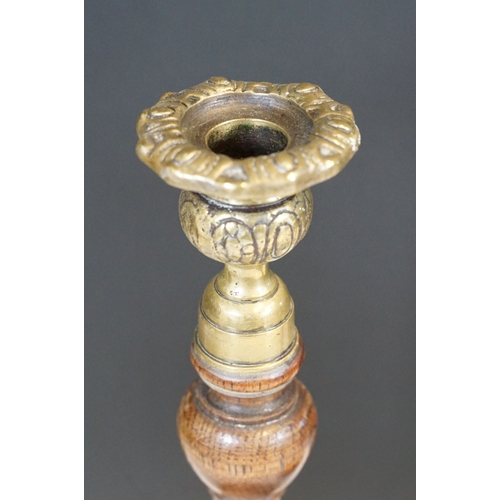 124 - Pair of early 20th century turned oak barley twist candle sticks with circular bases and ornate bras... 