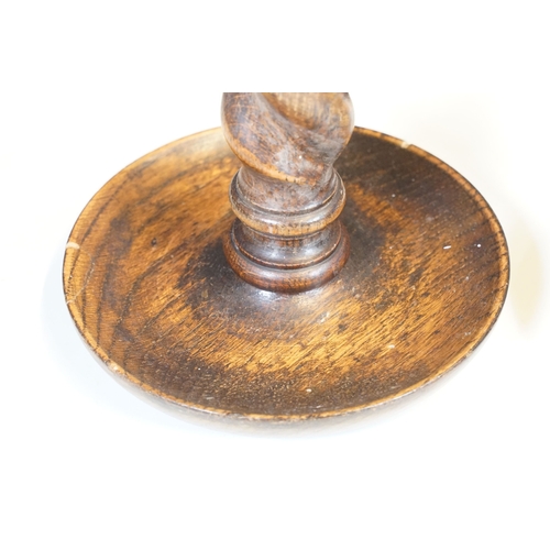 124 - Pair of early 20th century turned oak barley twist candle sticks with circular bases and ornate bras... 