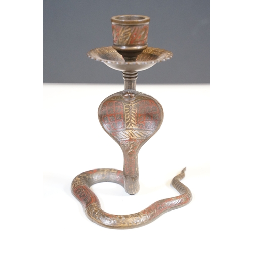 138 - Pair of coiled cobra candlesticks, H 15cm together with a small Indian brass vase, H 9cm (3)