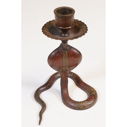 138 - Pair of coiled cobra candlesticks, H 15cm together with a small Indian brass vase, H 9cm (3)