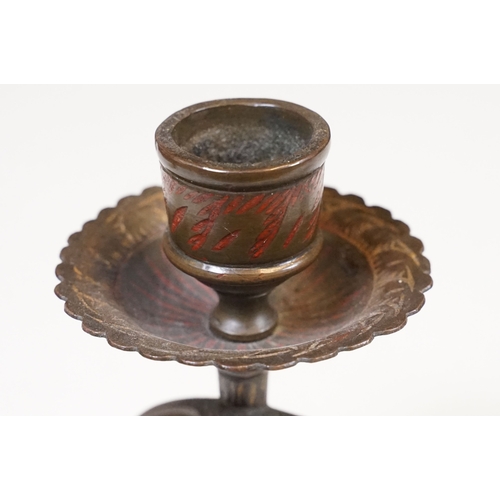 138 - Pair of coiled cobra candlesticks, H 15cm together with a small Indian brass vase, H 9cm (3)