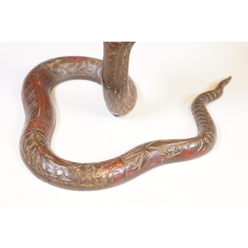 138 - Pair of coiled cobra candlesticks, H 15cm together with a small Indian brass vase, H 9cm (3)