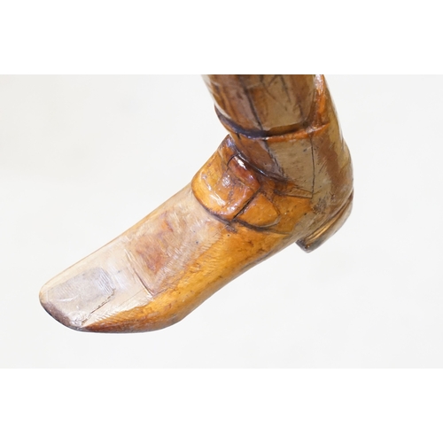 142 - Vintage folk art walking stick, the handle carved in the form of a 17th/18th century boot with buckl... 