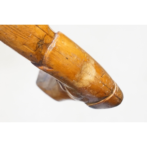 142 - Vintage folk art walking stick, the handle carved in the form of a 17th/18th century boot with buckl... 