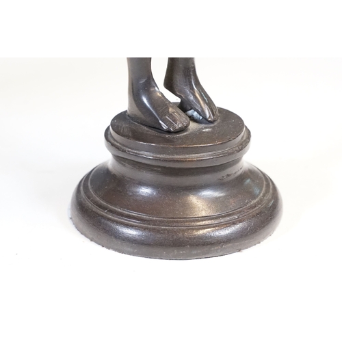 144 - Pair of Indian bronze candelabra candle holders depicting figures holding torches raised on circular... 