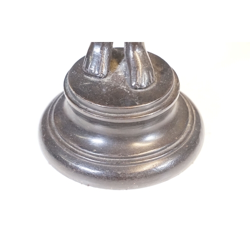 144 - Pair of Indian bronze candelabra candle holders depicting figures holding torches raised on circular... 