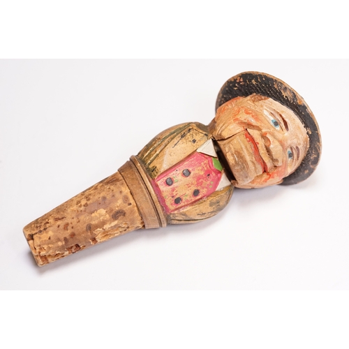 180 - Two vintage novelty folk art carved wooden and cork figural wine bottle stoppers, probably German