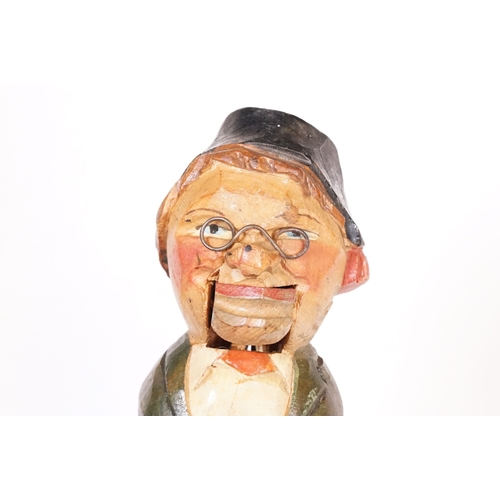 180 - Two vintage novelty folk art carved wooden and cork figural wine bottle stoppers, probably German