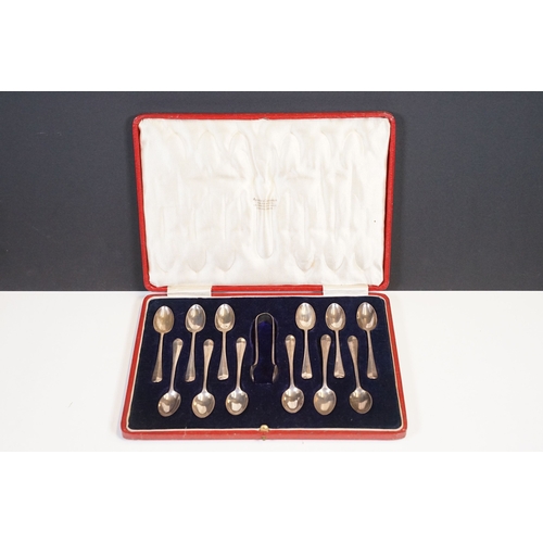 209 - A cased set of twelve fully hallmarked sterling silver teaspoons complete with sugar tongs.