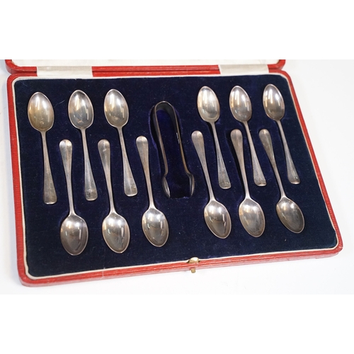 209 - A cased set of twelve fully hallmarked sterling silver teaspoons complete with sugar tongs.