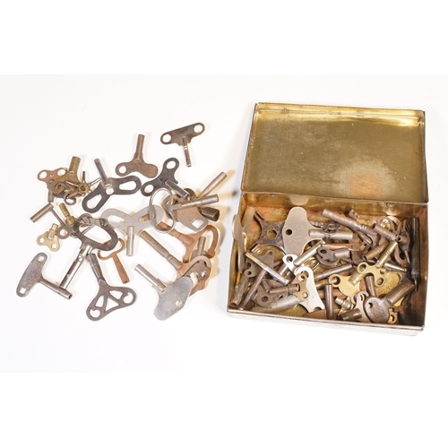 211 - A collection of vintage and contemporary clock keys within a vintage tin box.
