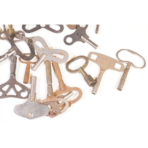 211 - A collection of vintage and contemporary clock keys within a vintage tin box.
