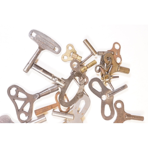 211 - A collection of vintage and contemporary clock keys within a vintage tin box.