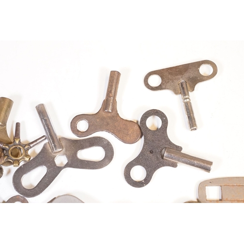 211 - A collection of vintage and contemporary clock keys within a vintage tin box.