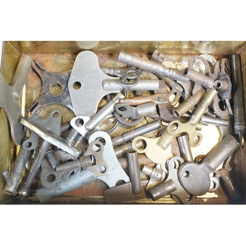 211 - A collection of vintage and contemporary clock keys within a vintage tin box.
